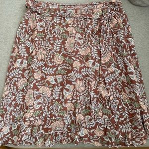 Anthropologie faux wrap mini skirt with ruffle edge. Size small.